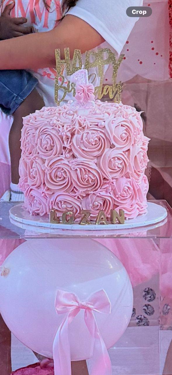 Pink rosette-piped cake with a gold 'Happy Birthday' topper and gold name plaque, Lozan